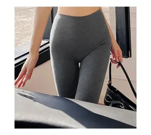 Ribbed high-waist yoga leggings detail, stretchy dark grey knit athletic pants for women.
