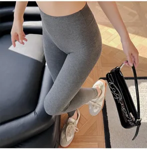 Grey ribbed high-waist yoga leggings detail view, seamless stretchy knit activewear fit.