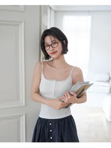 White ribbed knit camisole with delicate lace trim and front buttons for stylish summer wear.