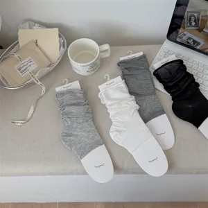 Detailed view of ballet style stirrup socks leg warmers in various neutral colors for spring summer.
