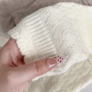 Cozy knit wool stirrup leg warmers with delicate diamond pattern, soft and warm for winter.