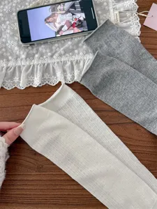 Details of ballet style stirrup leg warmers, soft hollow knit fabric for spring and summer.