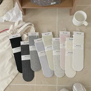 Women modal cotton ruffle mid-tube slouch socks in solid colors, soft spring and summer wear.