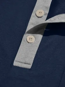 Men's casual short sleeve polo shirt contrast placket button detail close up view.