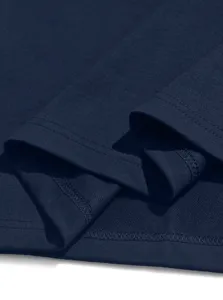 Close-up detail of navy blue short sleeve polo shirt fabric and fine stitching craftsmanship.