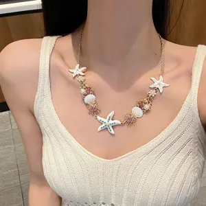 Hawaiian style starfish shell pearl necklace detail, colorful seaside vacation chain.