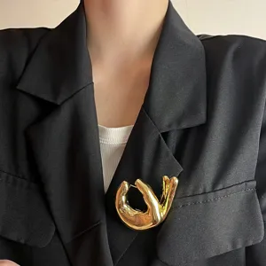 Gold OK hand gesture brooch detail view, exquisite metal fashion corsage pin for women clothing.