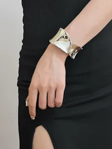 Wide silver metallic cuff bracelet for women, open geometric metal bangle fashion jewelry.