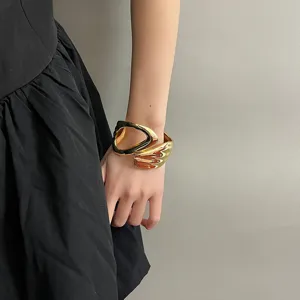 Chic minimalist gold open cuff bracelet, bold geometric hollow metal wristband jewelry for women.