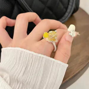 Handmade wire wrapped ring featuring natural yellow raw stone and colorful beads for women fashion.