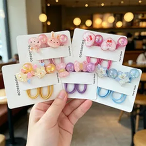 Close-up of colorful acrylic charm hair elastics with cute animal and heart shapes