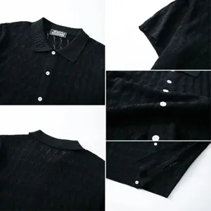 Detailed view of black men's jacquard knit polo shirt showing texture and white buttons.
