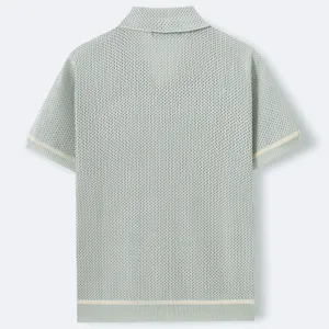 Back view detail of light green knitted short sleeve polo shirt with hollow texture