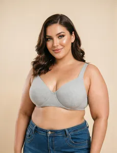 Close-up view of a comfortable grey plus size full coverage bra for women in studio light.