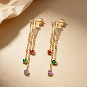 Detailed macro view of S925 sterling silver gold earrings with colorful zircon tassels