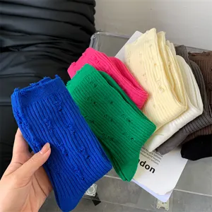 Women's autumn winter distressed solid color slouch socks detailed view showcasing soft cotton texture