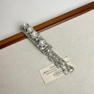 Exquisite heavy work silver zircon pearl hair clip detail, elegant bridal side hairpin accessory.