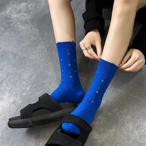 Blue distressed socks for women, stylish knit ripped crew socks for autumn and winter.