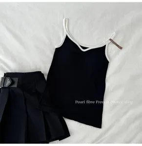 Women's black seamless V-neck camisole with white trim, pearl fiber material, elegant French style.