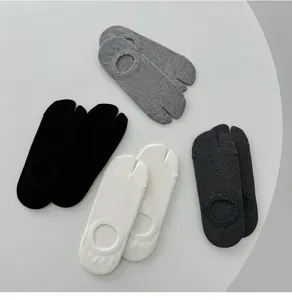 Close-up detail of split-toe invisible socks in multi-colors, soft cotton boat socks.