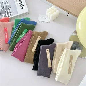 Comfortable cotton solid candy color mid-tube women socks for daily wear and four seasons.
