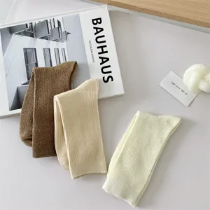 Solid color cotton women's mid-tube socks, comfortable daily casual breathable hosiery.