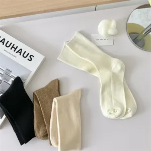 Detailed view of solid color cotton women's mid-tube socks in stylish everyday colors.