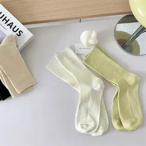 Solid color candy cotton women mid-tube socks, soft double needle daily casual wear.