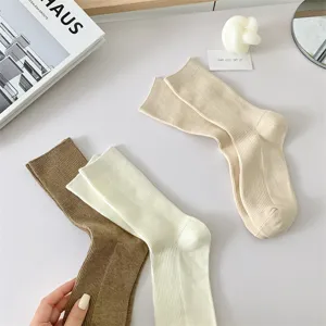 Comfortable solid color ribbed cotton mid-calf women socks, perfect for daily wear all year.