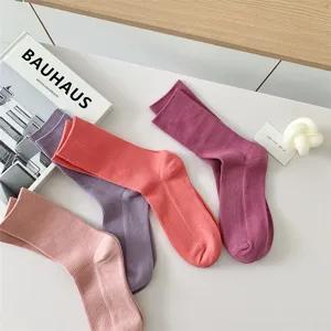 Solid color cotton women's mid-tube socks detail shot, candy color casual cute daily wear.