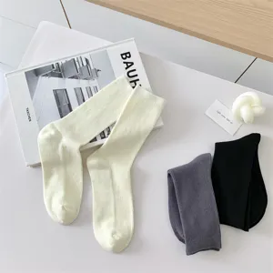Comfortable solid color cotton mid-calf socks for women, perfect for daily casual wear.