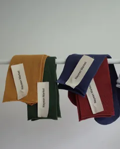 Detailed shot of ribbed roll cuff cotton mid tube socks in vibrant candy colors and soft texture.