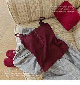 Wine red ribbed camisole with lace trim and buttons, cozy layering apparel for women.