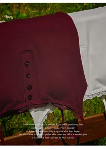 Ribbed thermal camisole with henley button placket and delicate lace trim for women.