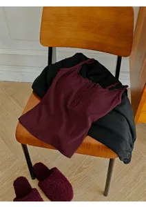 Burgundy ribbed camisole with lace trim, henley button neck and built-in bra for women.
