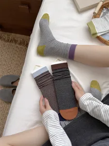 Comfortable cotton striped mid-tube socks featuring color block design for women's daily wear.