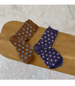 Cute cotton mid-tube women socks with stylish large polka dots, cozy autumn winter daily wear detail.
