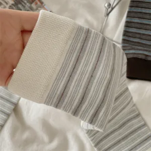 Close-up detail shot of women's knitted striped mid-tube slouch socks, soft texture.