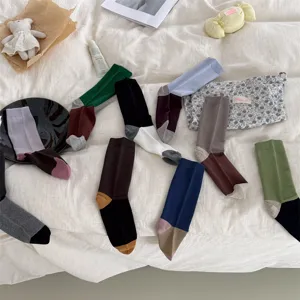 Cozy cotton color block mid-tube socks for women, stylish design ideal for winter daily wear.
