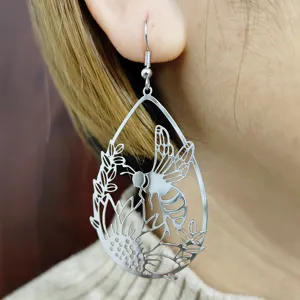 Orecchini pendenti a goccia color argento con design cavo di api e fiori per donne eleganti.