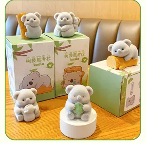 Cute flocked koala figurines set with gift boxes, perfect for car dashboard and desktop decor.