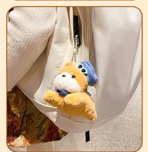 Cute dog plush keychain bag charm detail shot showcasing fluffy texture and trendy accessories.