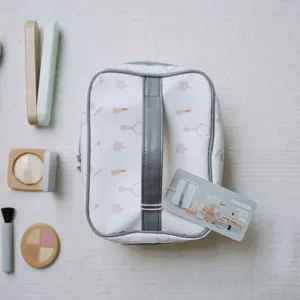 Detailed view of kids wooden makeup toy set, featuring cosmetic handbag, brush and beauty tools.