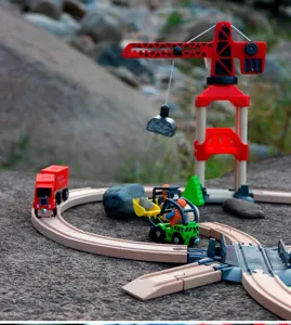 Wooden toy train track set with crane and vehicles for kids creative play detail view