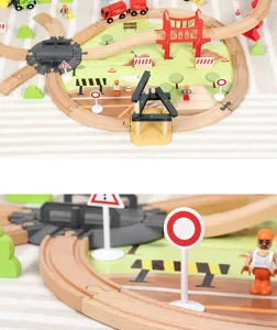 Wooden railway track toy detail view showing bridge, mini figures and colorful train cars.