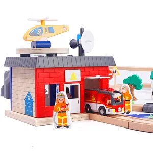 Wooden fire station toy set with tracks, helicopter, and fire truck for kids play.