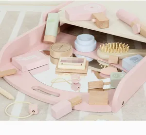 Wooden pretend play vanity makeup toy set detail showing miniature wooden cosmetics and tools.
