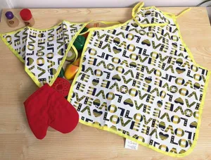 Children wooden pretend play kitchen toy set with printed apron and cutting fruit models.