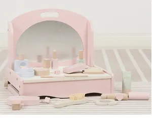 Detailed close-up of wooden pretend makeup vanity set, featuring cute wooden toys and accessories.