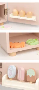 Wooden toy kitchen detail shot showing cute pastel accessories like eggs, crab and ice cream.
